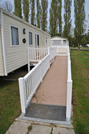 Wheelchair ramp makes it easire to get in a holiday caravan